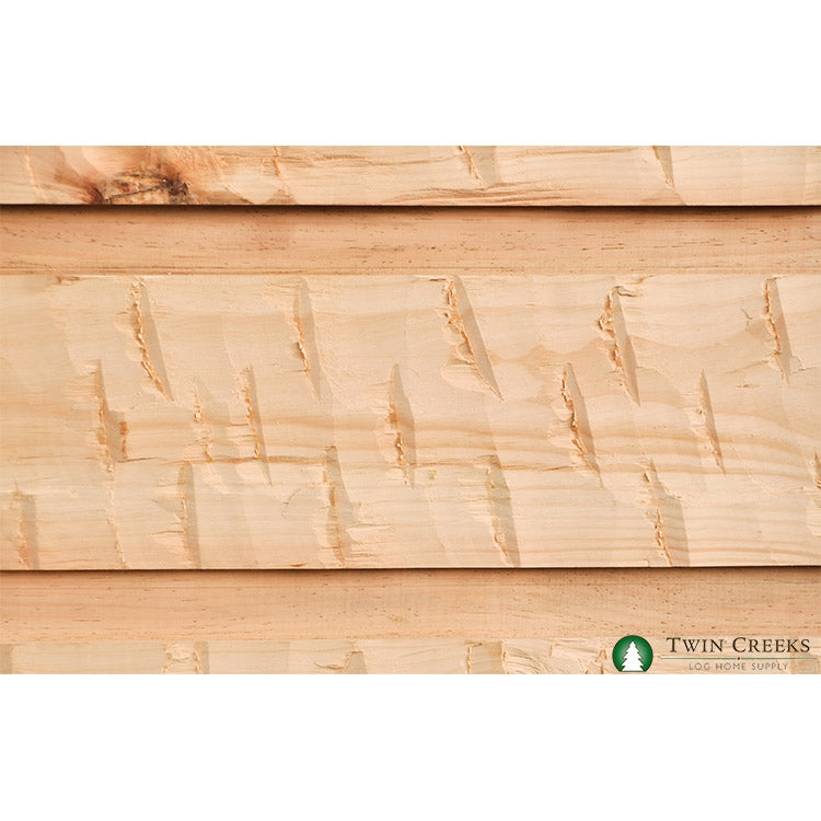 Our Antique Hewing Option on a 5/4x12 Square Chink Log Siding